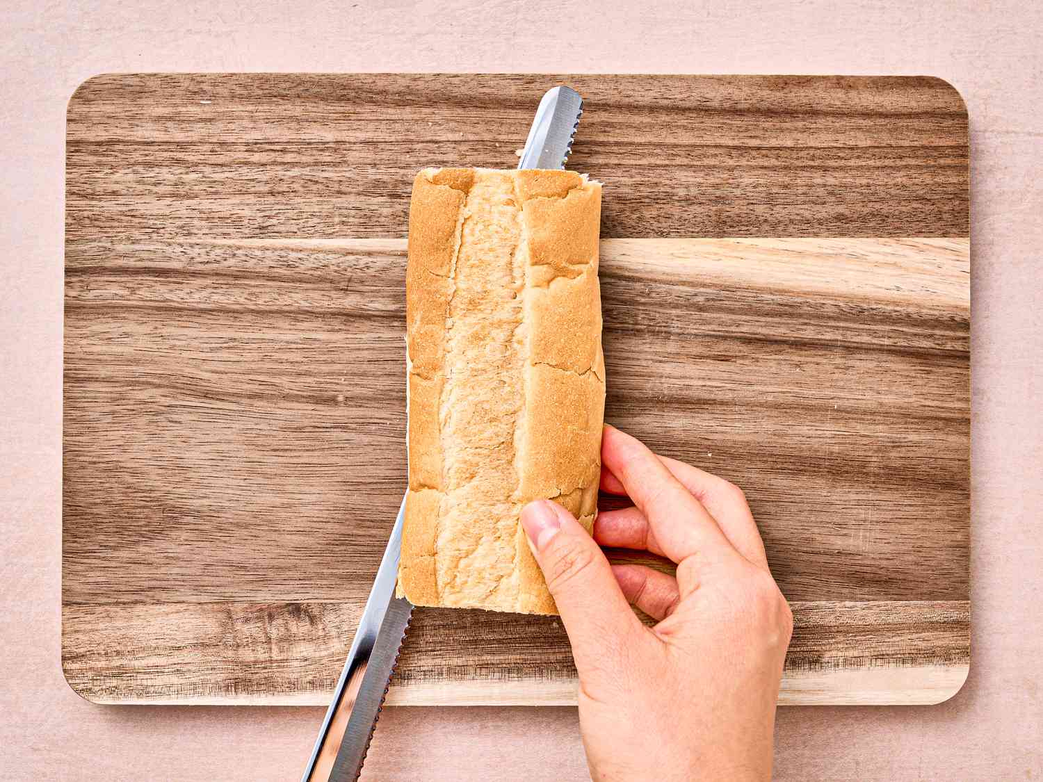Overhead view of cutting bread