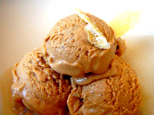 Closeup of three scoops of Trappist ale and gingerbread ice cream in a white bowl.