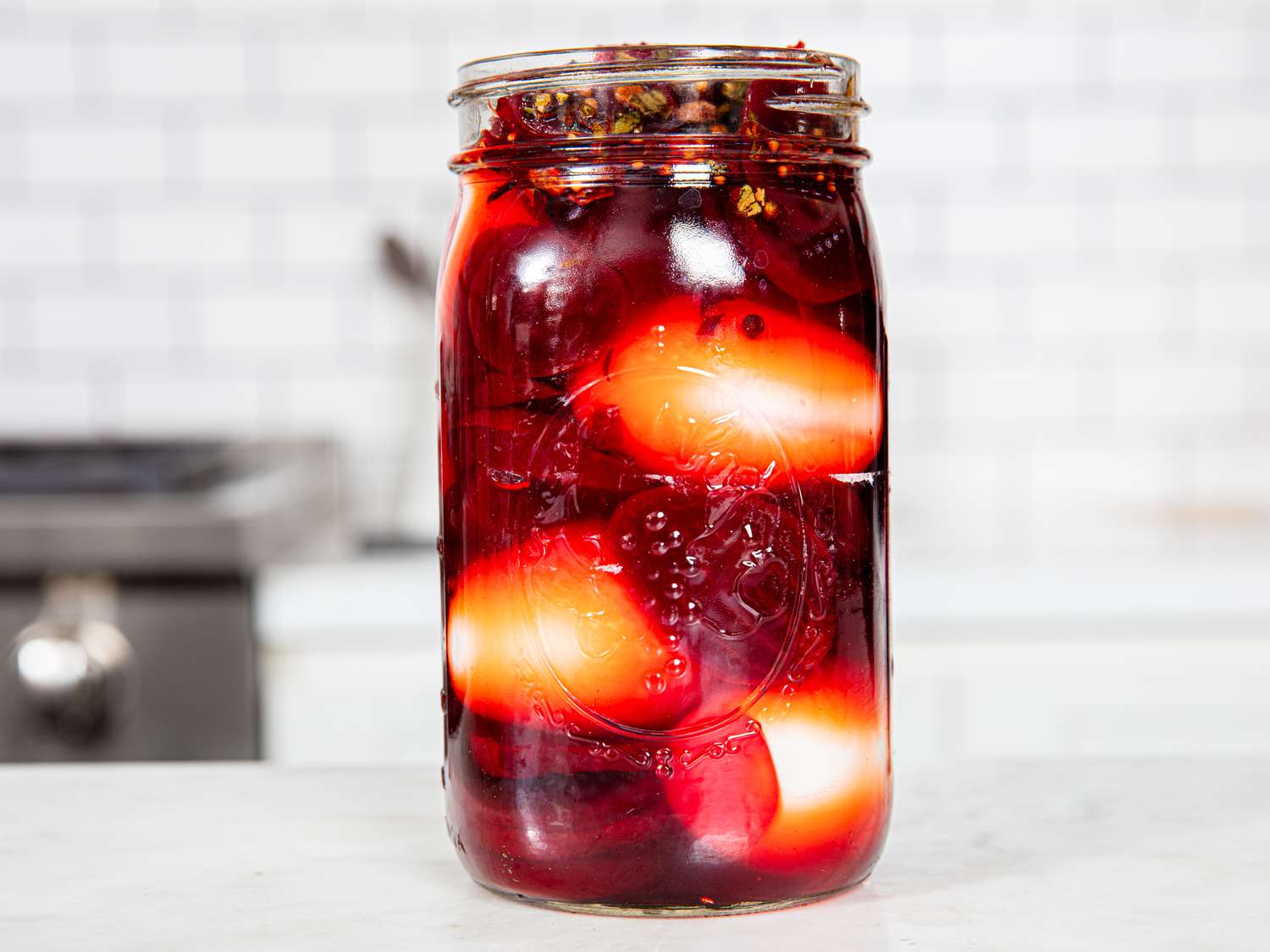 Eggs in jar with pickling liquid and beets