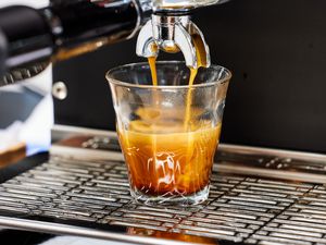 Closeup of the Diletta Mio Espresso Machine brewing an espresso into a glass