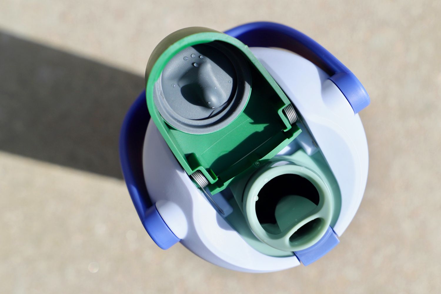 A top-down view of the Owala FreeSip Sway water bottle's sip-or-chug mouthpiece and improved seal.
