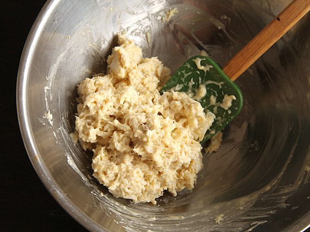Crab cake mixture bound by a thick binder made from panko breadcrumbs and egg. 