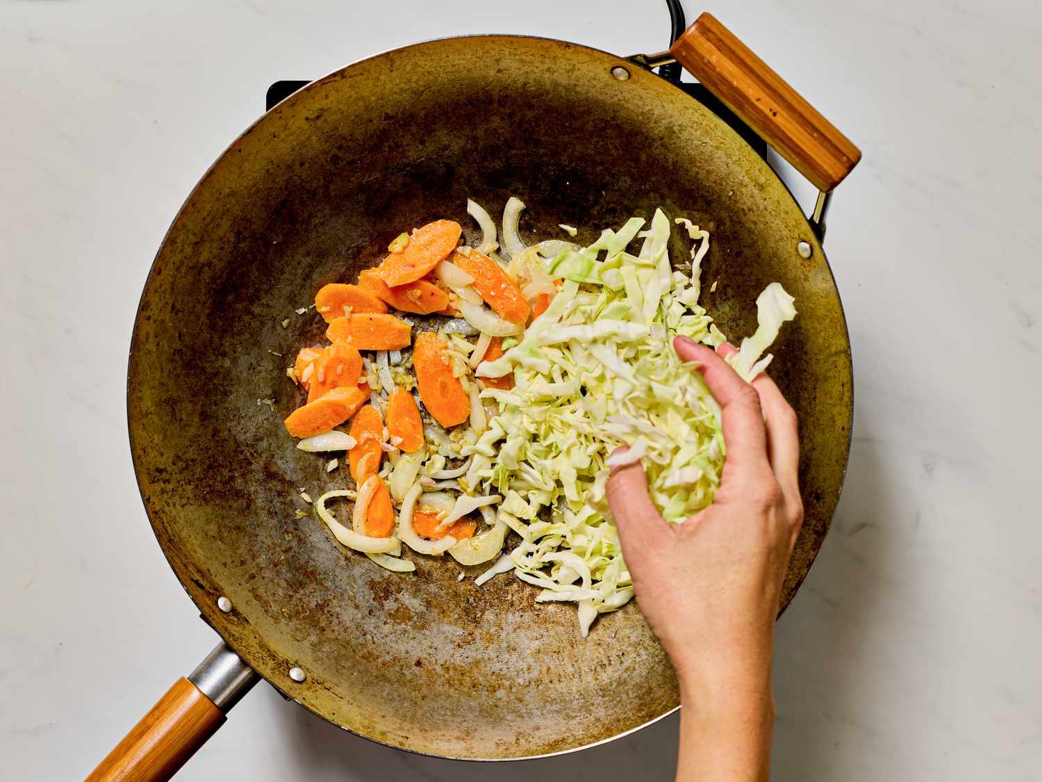 Cooking vegetables in a wok.