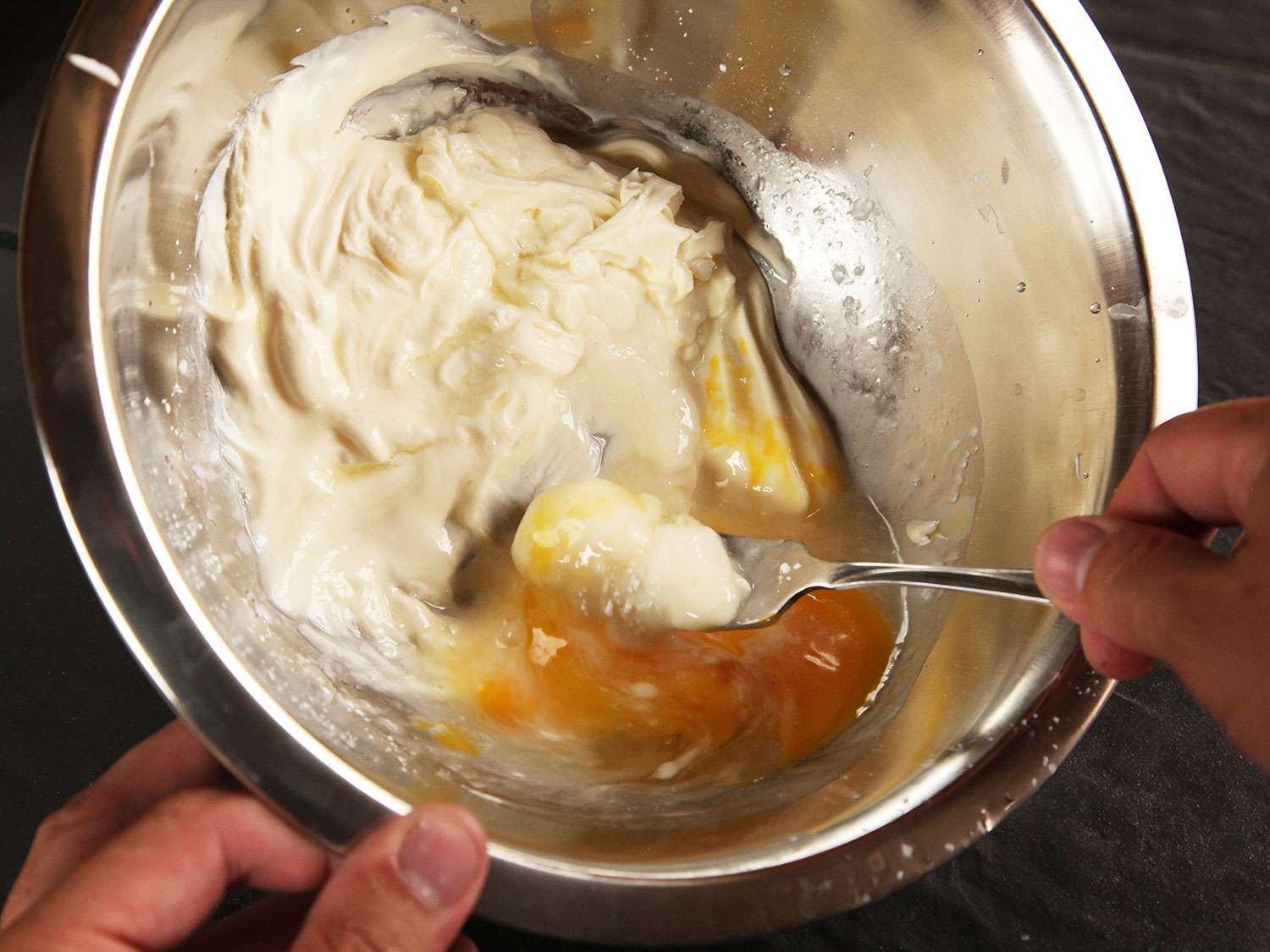 Whisking creme fraiche, egg, and cornstarch until combined with a spoon. 