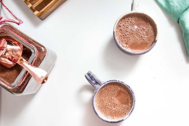 overhead view of two mugs of hot cocoa