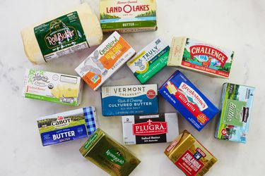 An assortment of salted butters on a white countertop.
