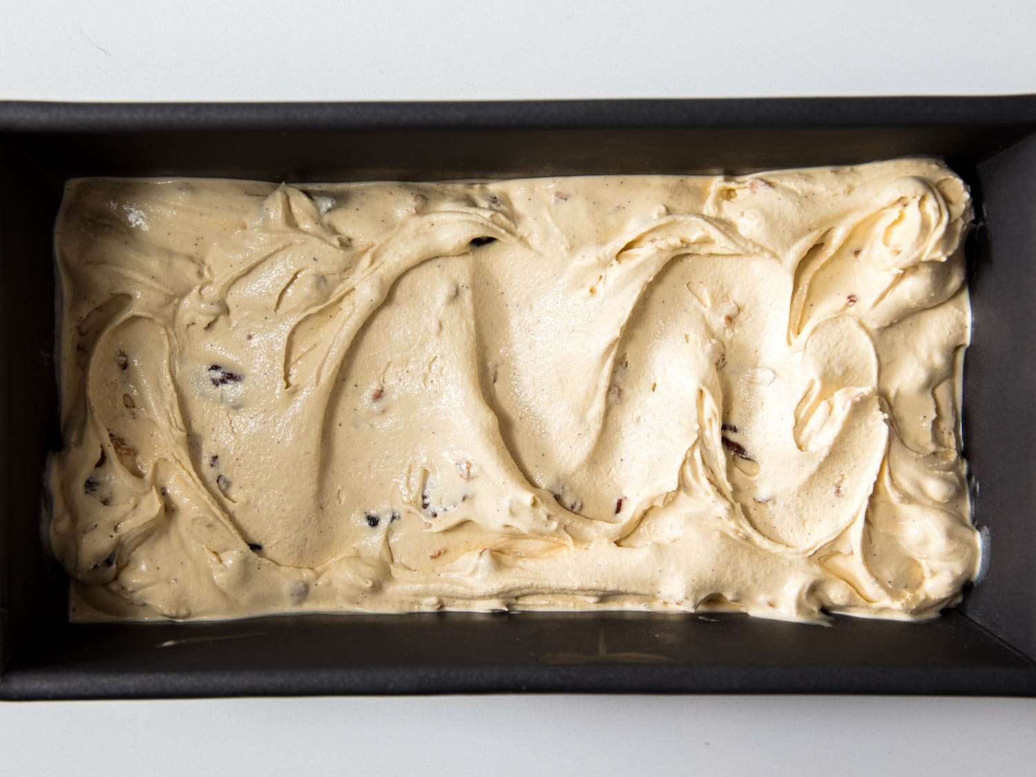 Oatmeal cookie ice cream without toppings in a loaf pan.