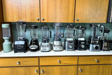 A group of blenders on a kitchen countertop