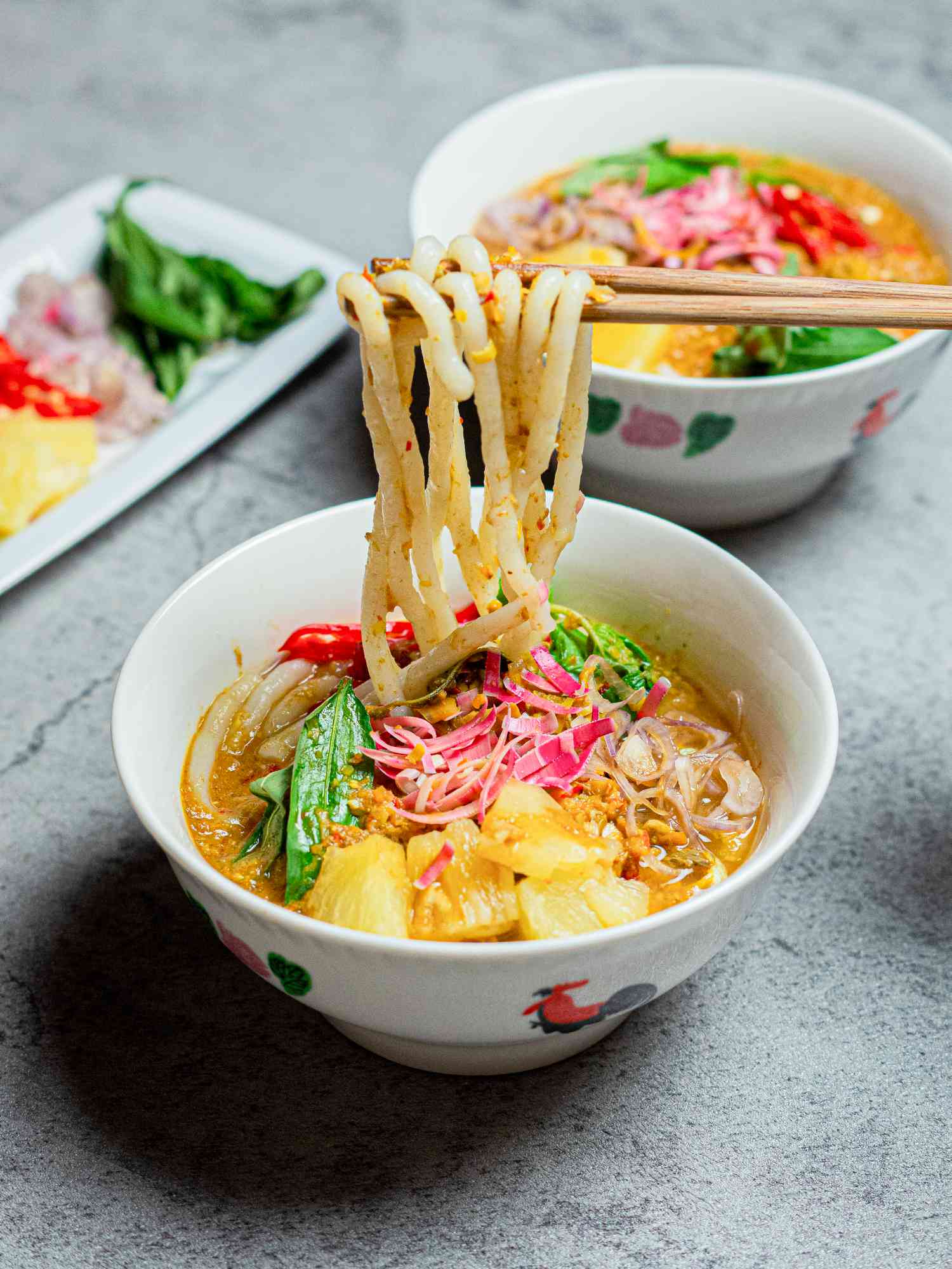 Side view of lifting noodles