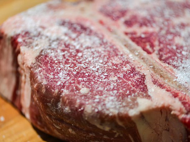 Close-up of the porterhouse, which has been generously showered with Kosher salt.