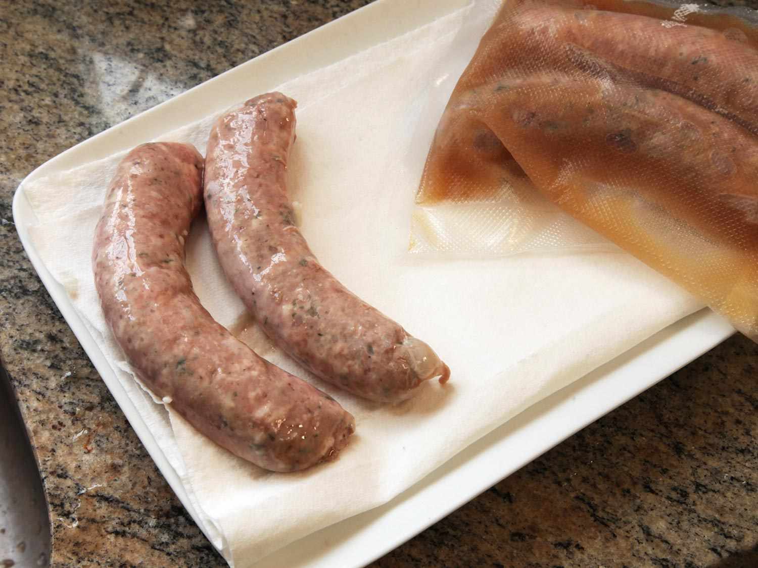 Drying sous vide sausage on a paper towel lined plate. 
