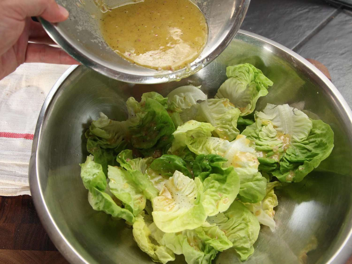 Author dresses little gem lettuce leaves with a simple vinaigrette.
