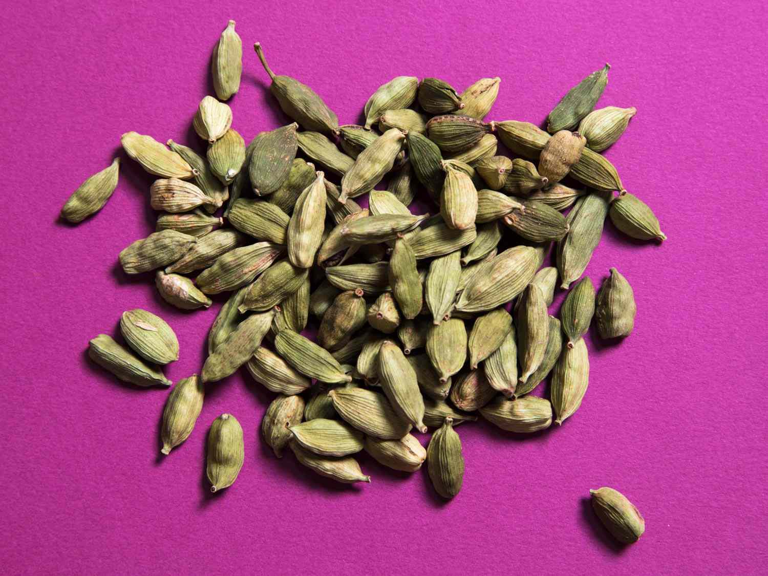 Closeup of green cardamom pods.