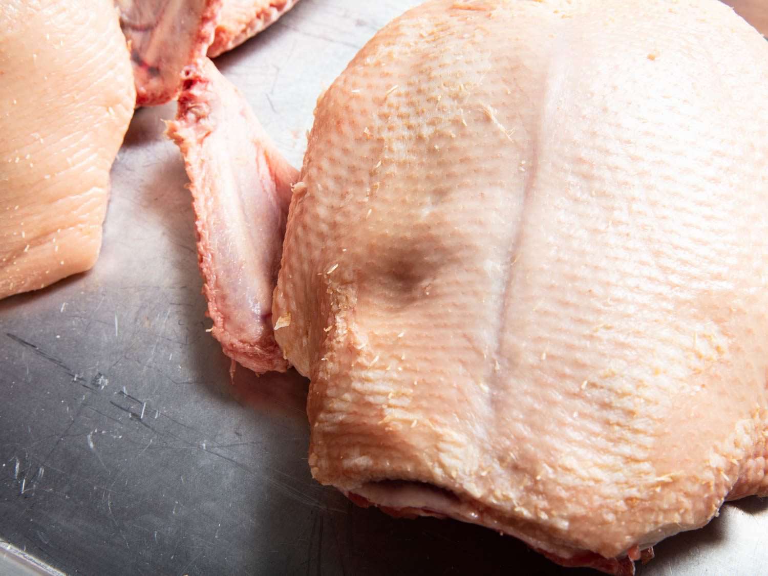 Dimple left from pressing on duck breast with a finger.