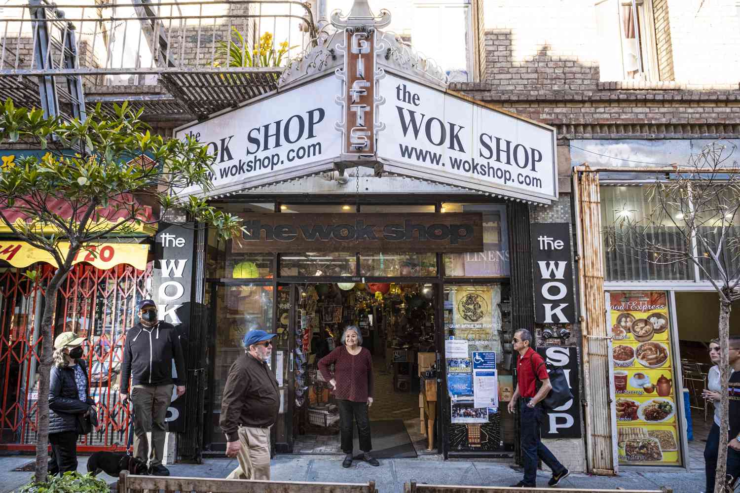 Tane Chan standing outside of the Wok Shop