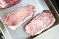 Two raw pieces of Good Chop meat on a metal tray