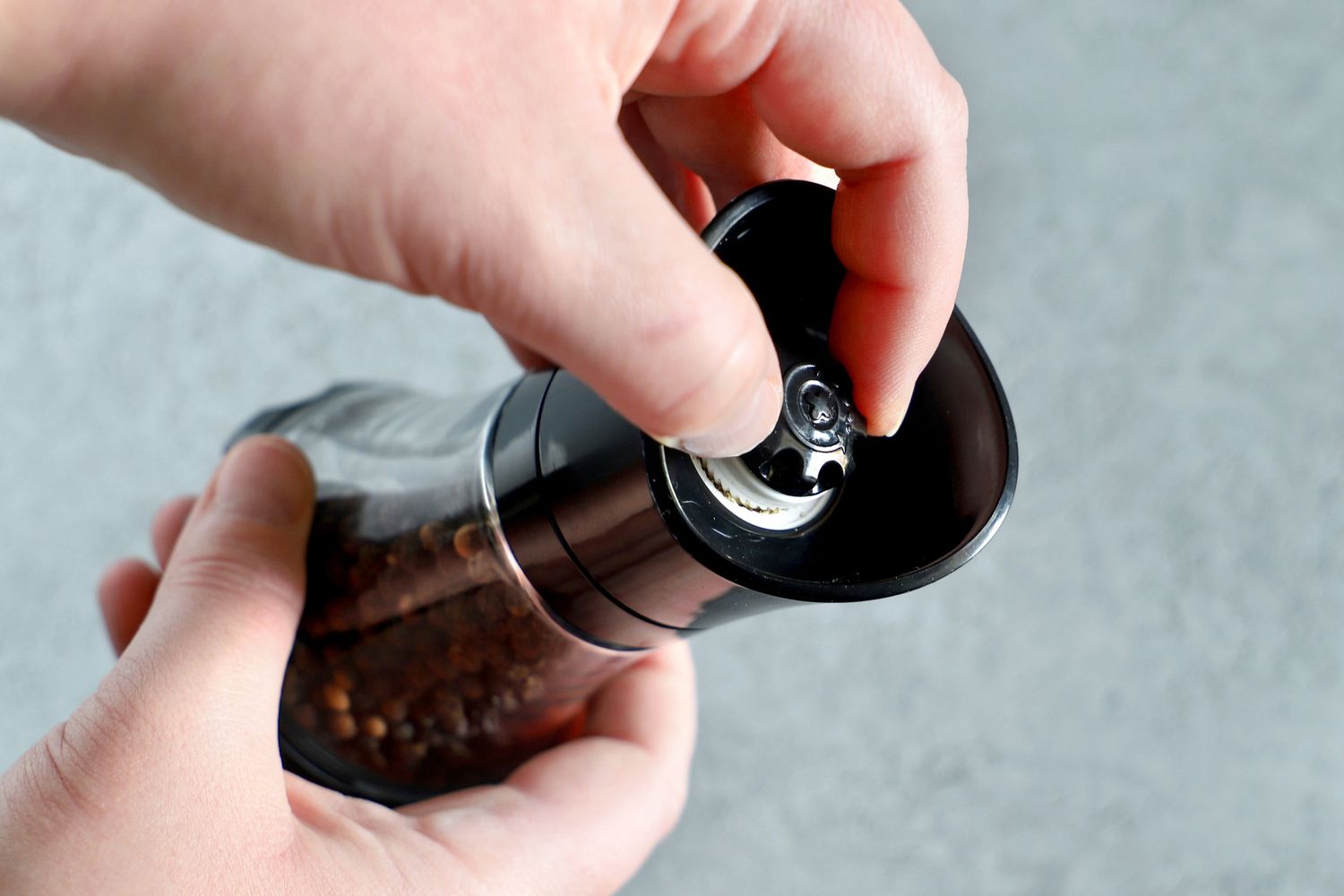 Person holding Kuhn Rikon Mini Pepper Grinder
