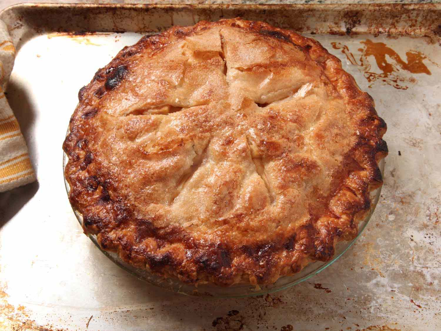 A golden brown baked apple pie.