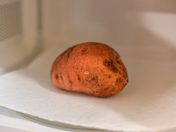 A sweet potato in the microwave.