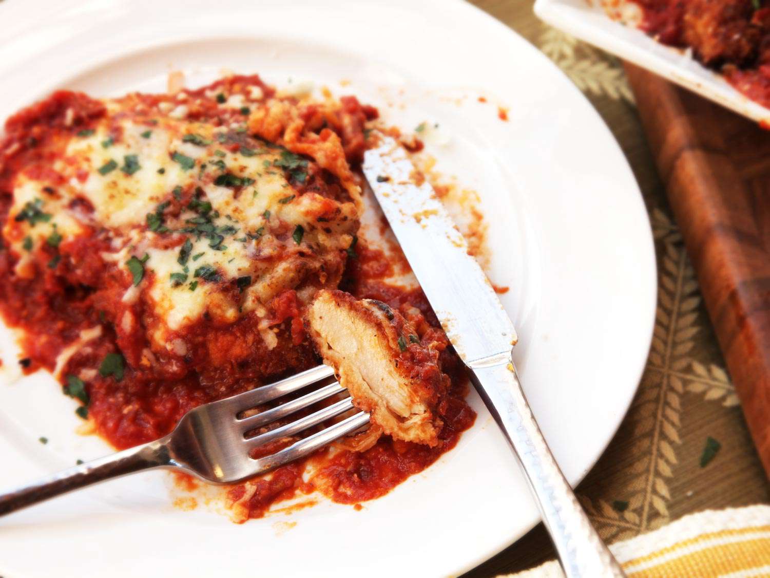 A forkful of chicken parmesan