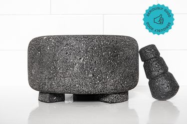The Masienda Molcajete on a white countertop. A graphic in the upper right corner states that it is a "Seriously Good" product.