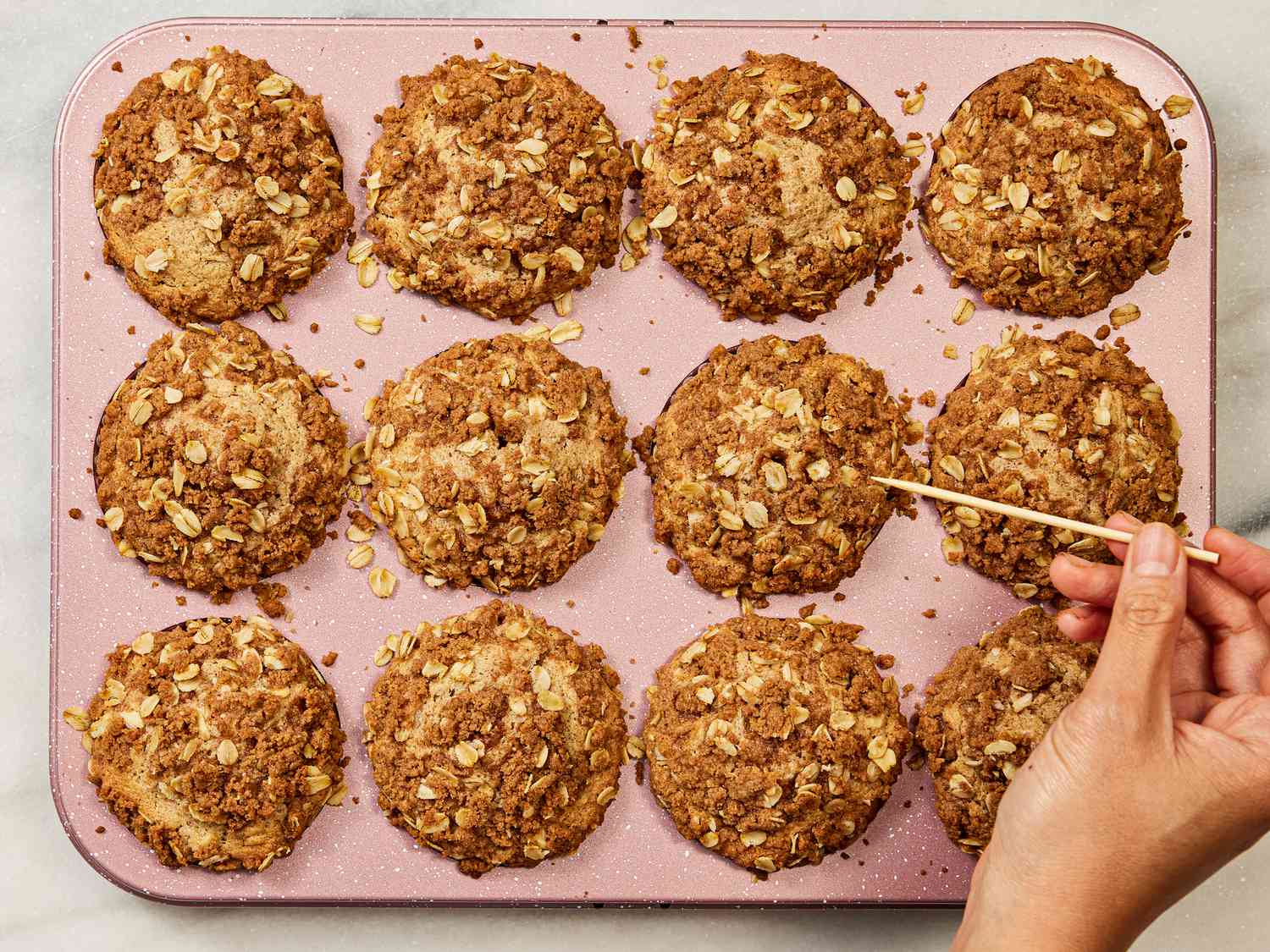 Overhead view of pricking muffin