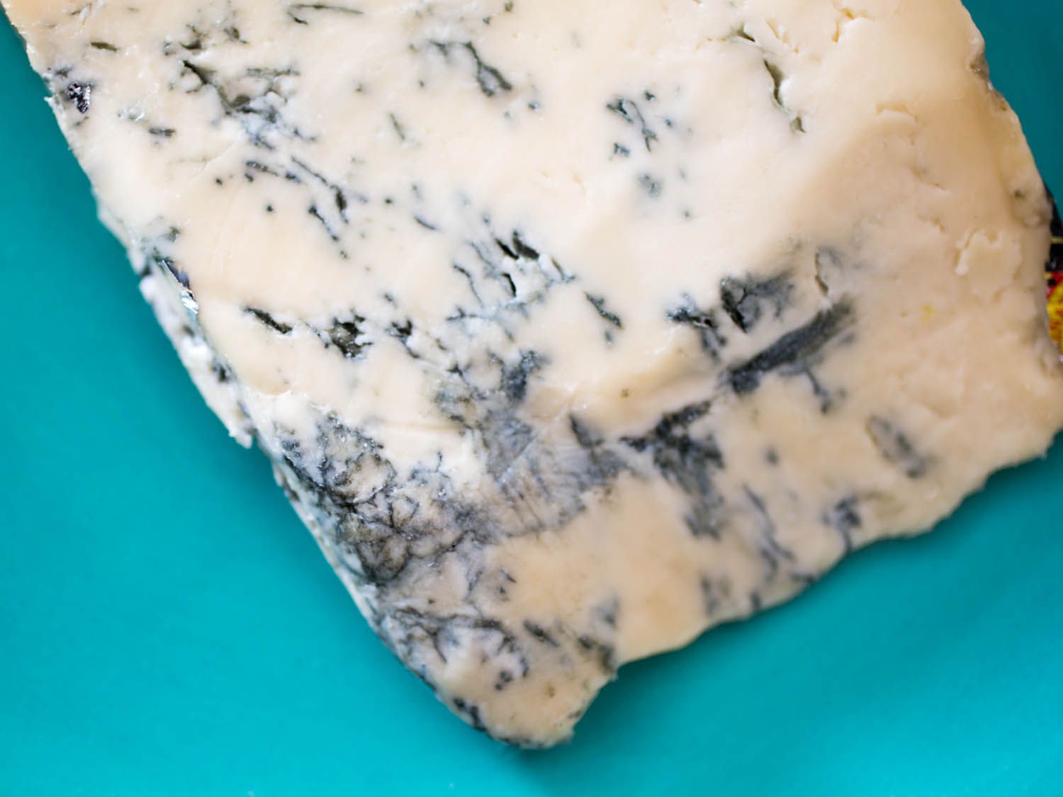 A wedge of gorgonzola dolce cheese 
