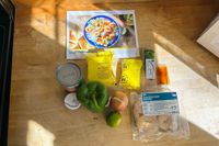 Marley Spoon meal ingredients arranged on a wood surface