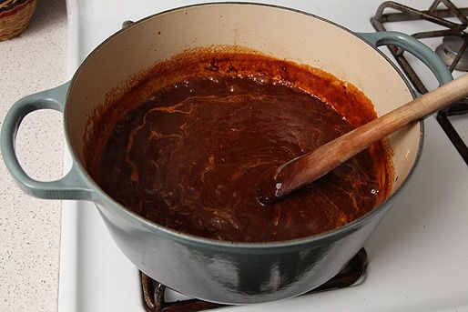 Carmelized onions mixed with puréed dried chiles in an enamel cast iron Dutch oven.