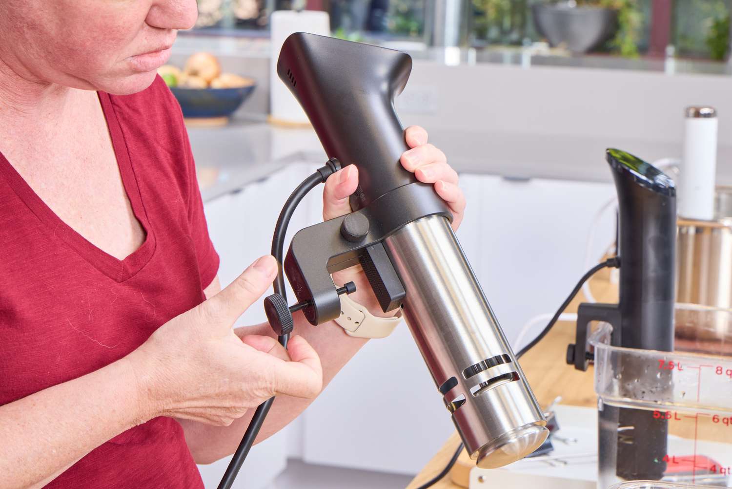 A person adjusts the Anova Culinary Precision Cooker Pro
