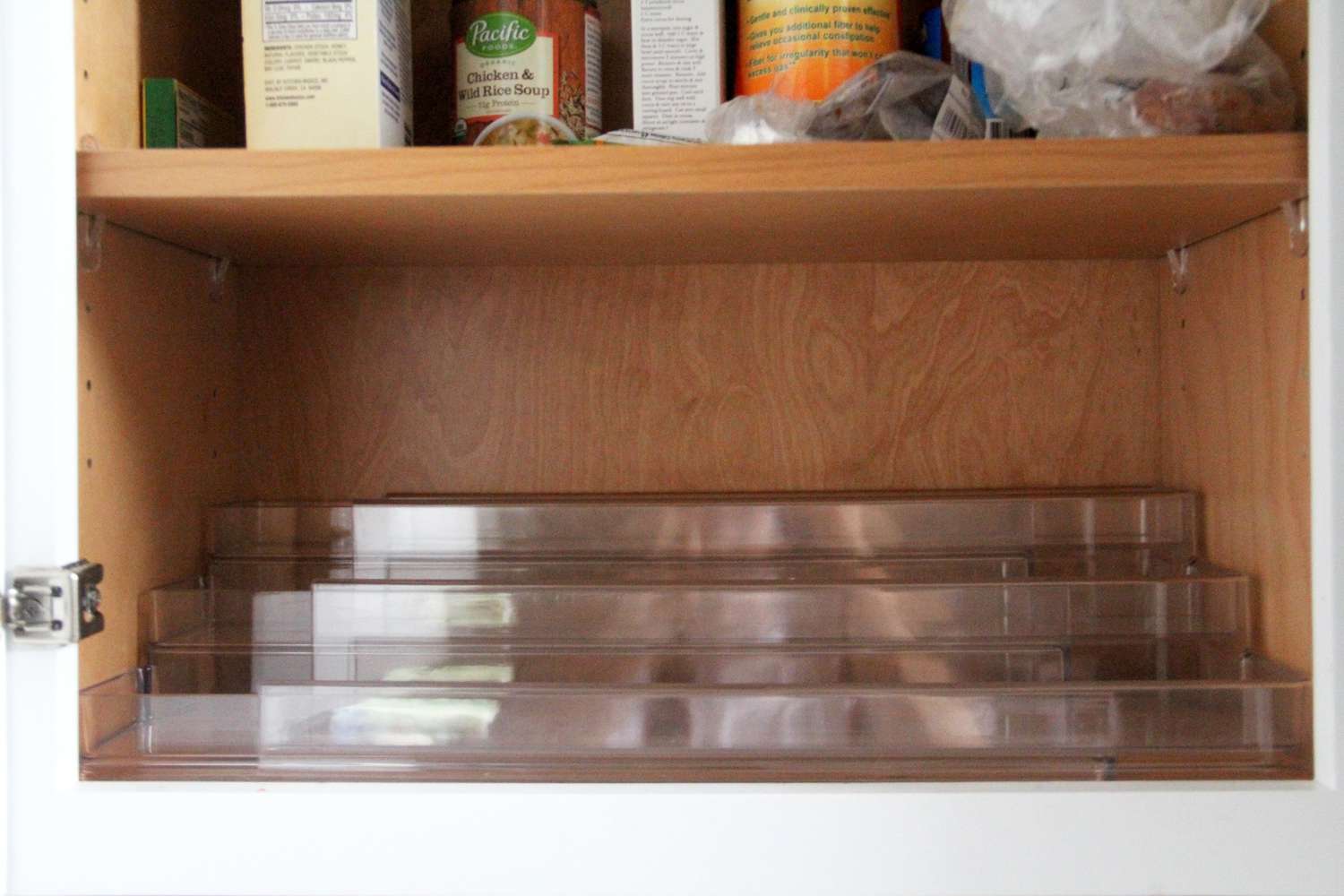 a spice rack that sits sturdily and steadily in a cabinet