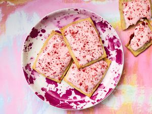 Plate of strawberry rhubarb pop-tarts on a colorful background