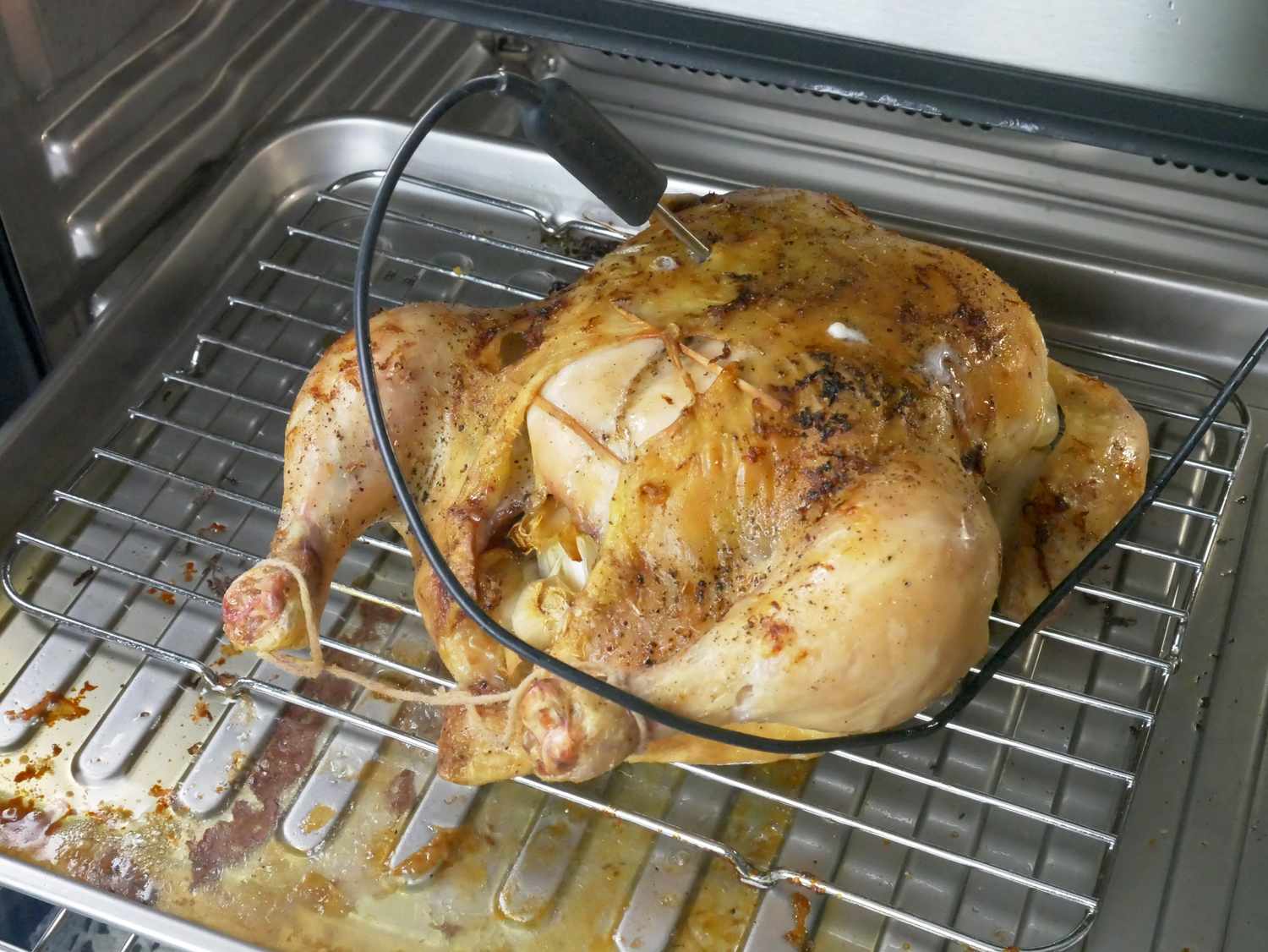 a roast chicken inside an oven