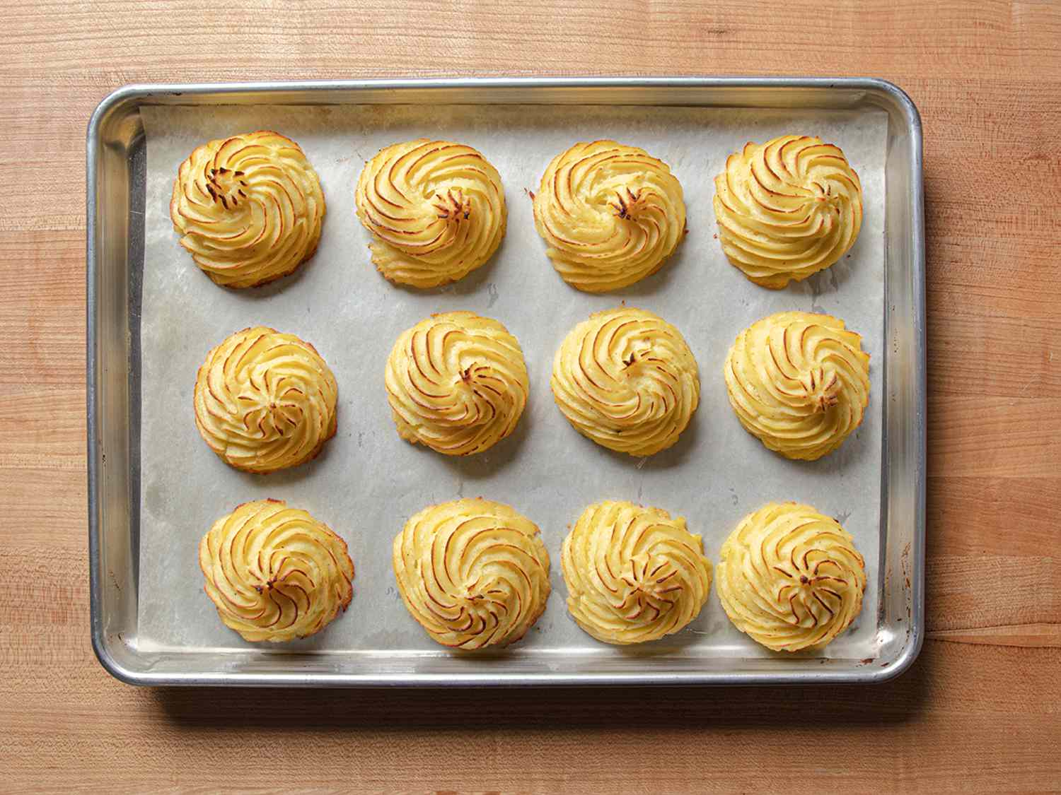 Baked Duchess potatoes.