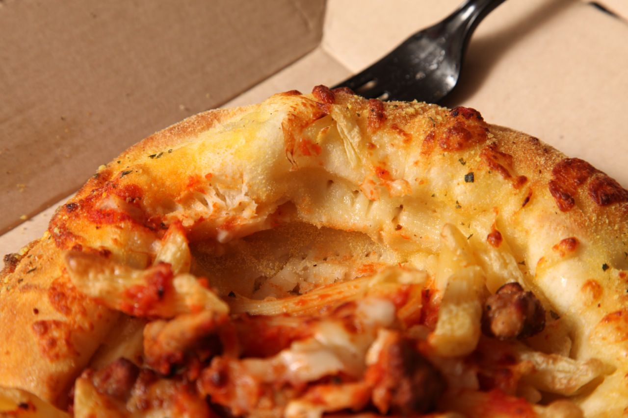 A close up of the inside of a bread bowl from Domino's 