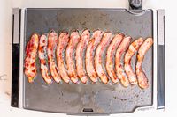 Bacon cooking on the Presto Tilt-N-Fold electric griddle