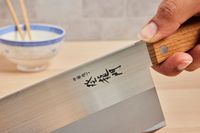 a closeup of the blade on a chinese cleaver