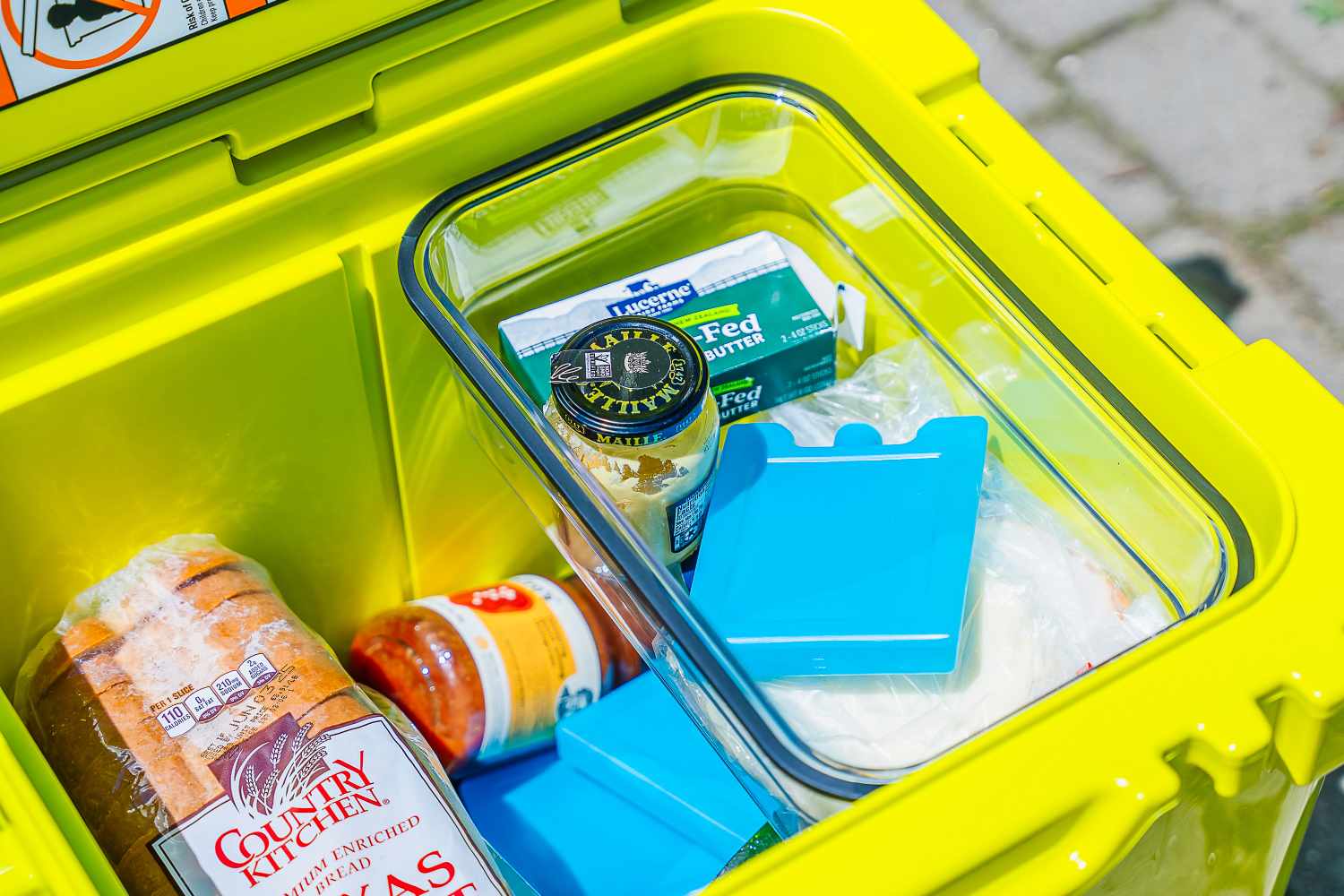 Inside the Yeti Roadie 48 Rolling Wheeled Cooler filled with groceries
