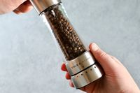 Person holding Cole & Mason Derwent Pepper Grinder