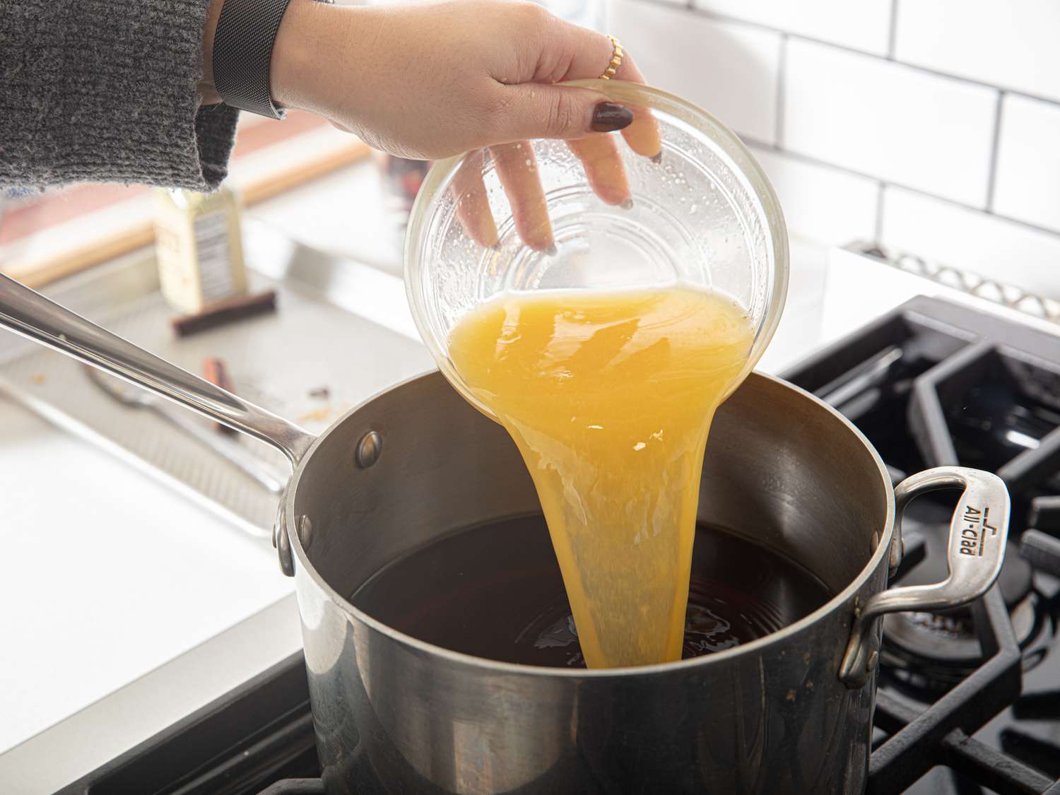 Side view of adding orange juice