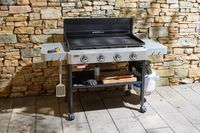 The Weber 36 Inch Gas Griddle outside on a patio