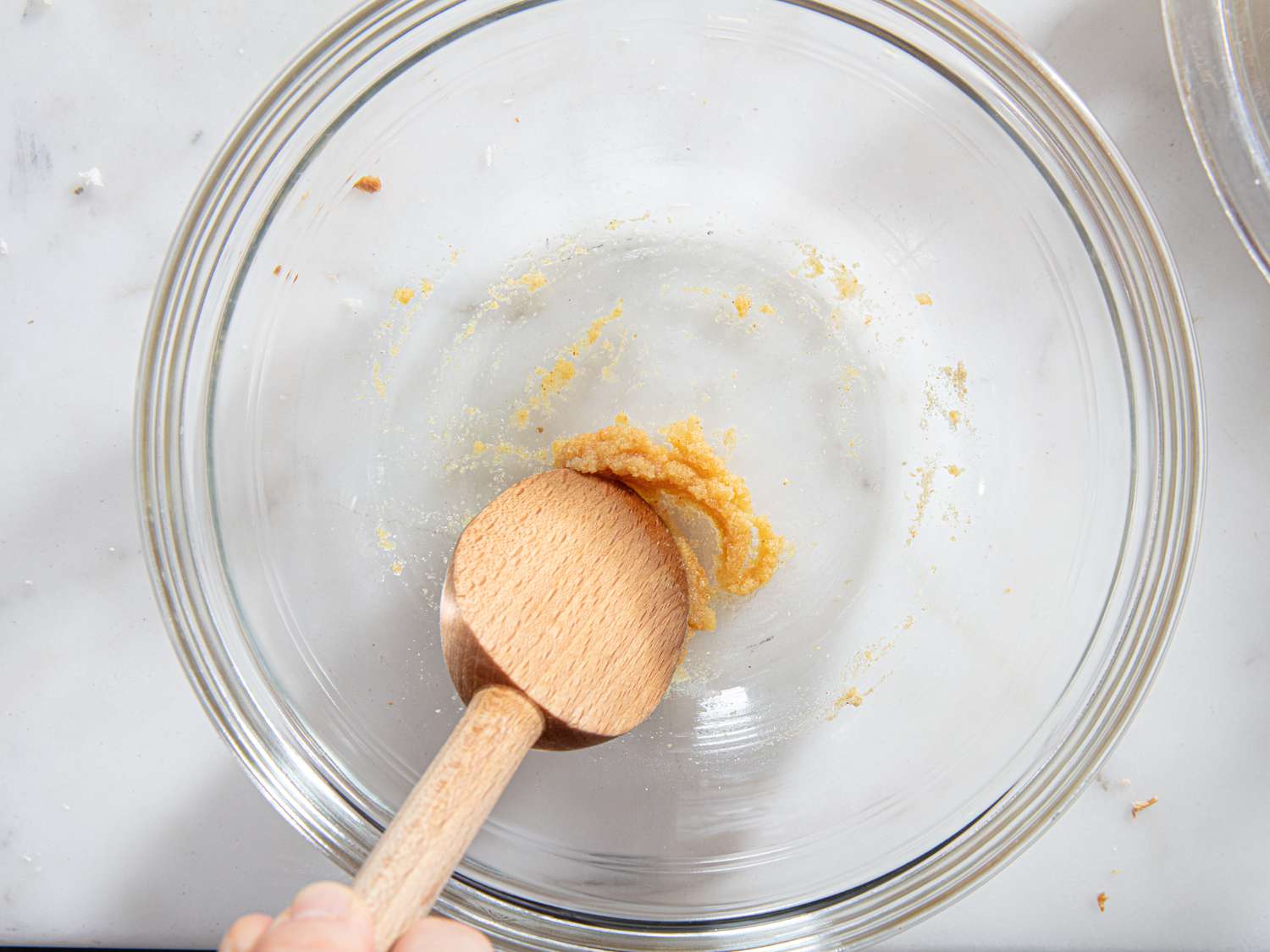 Overhead view of combining garlic powder and water