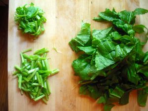 Asian leafy greens washed and sorted in order to be stir-fried. 