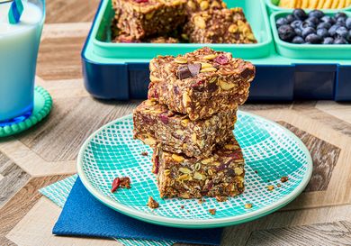 Stack of homemade protein bars on a patterned plate