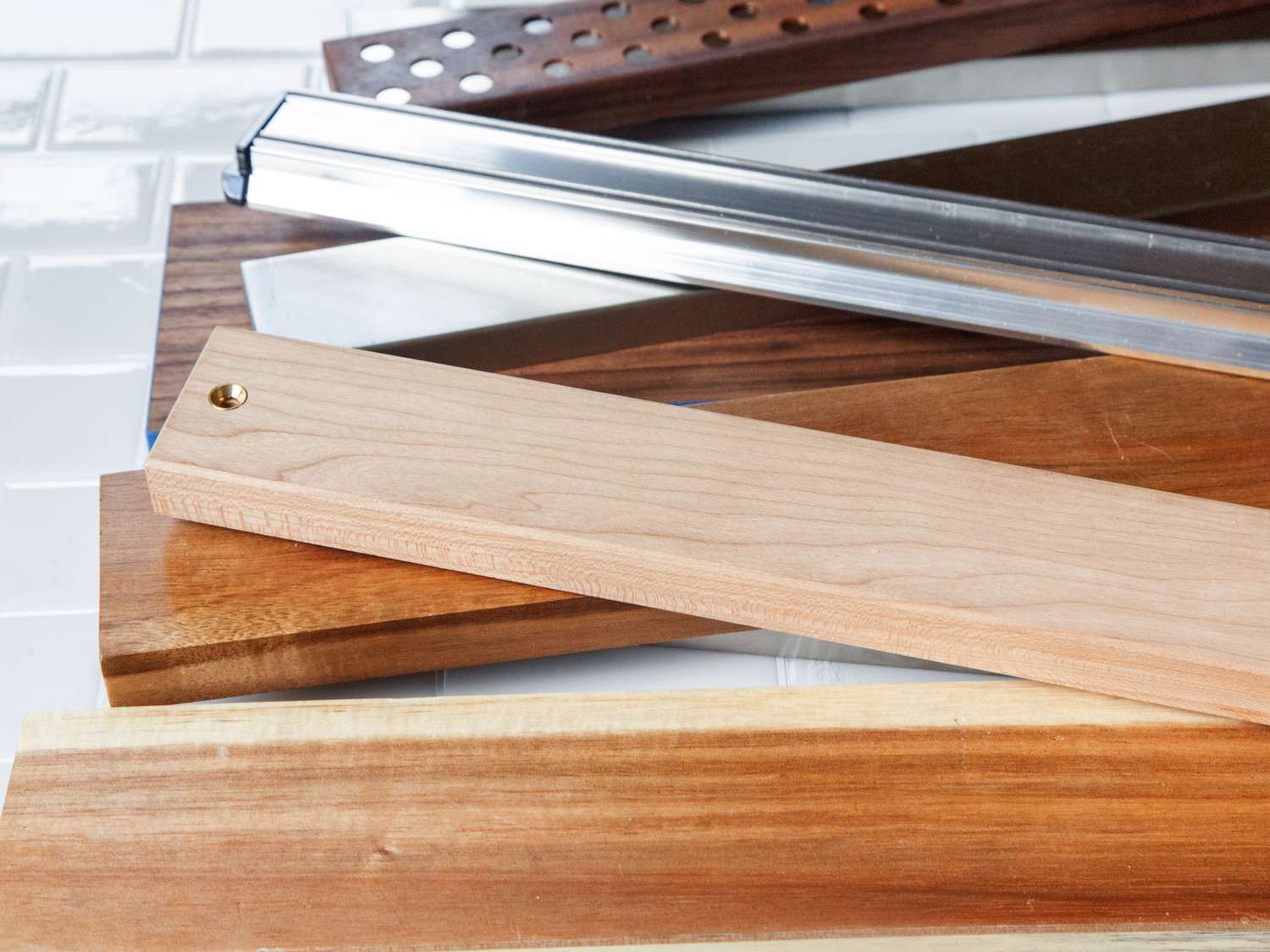 seven magnetic knife strips stacked on top of one another