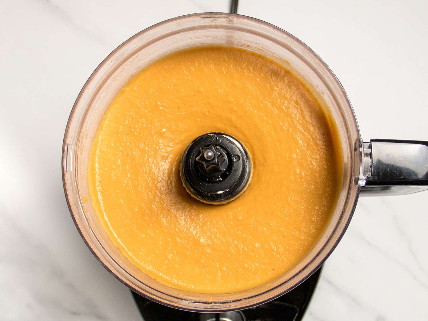 The sweet potatoes and cream cheese and seasonings after mixing in a food processor until very, very smooth.