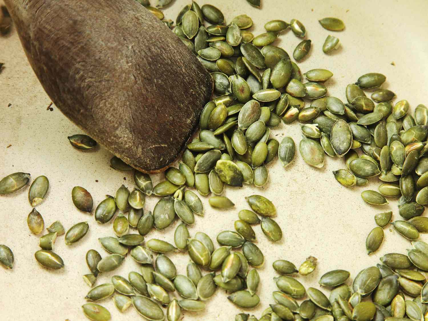 Pumpkin seeds are toasted in a dry Dutch oven for pozole verde.