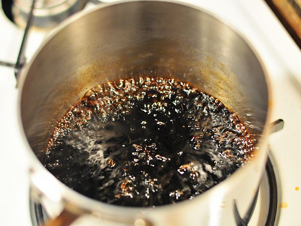 Soy sauce, sugar, mirin, and sake boiling in a sauce pan.