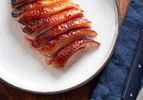 Crispy golden roasted duck crown sliced