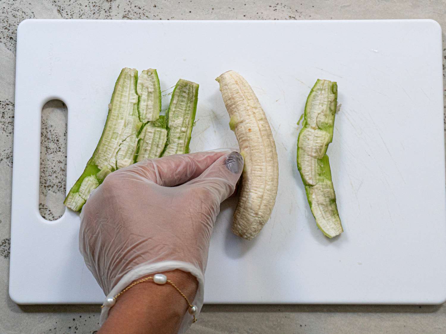Overhead view of peeling bananas